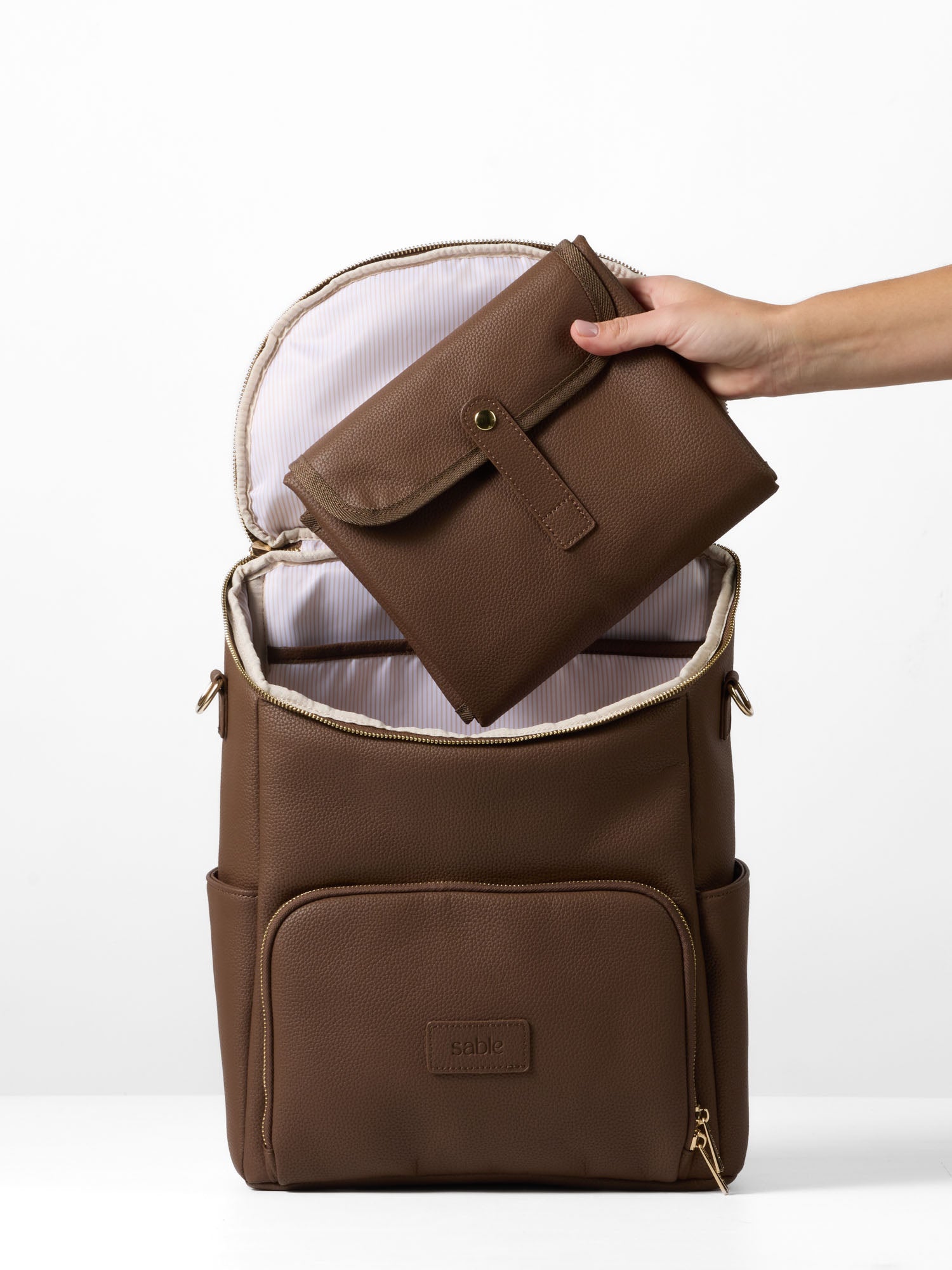 Baby changing bag bundle featuring a backpack and portable change mat