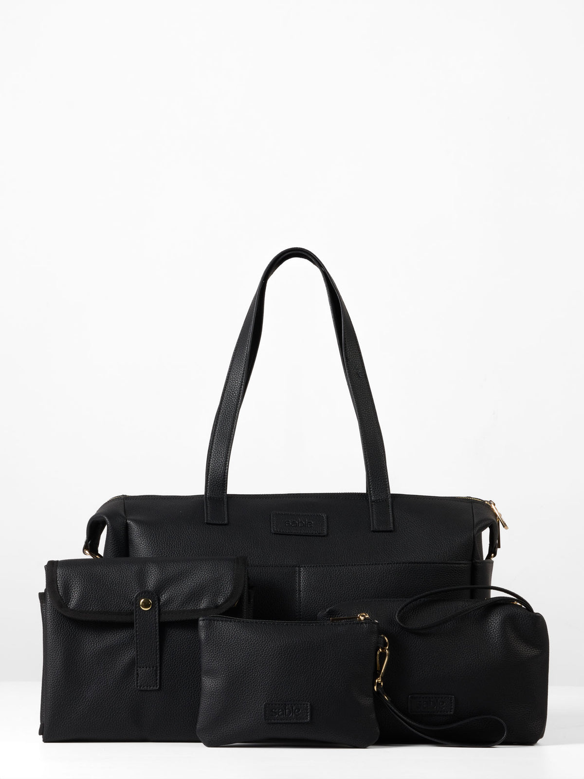 Black nappy bag set containing a nappy bag, change mat, wet bag and small zipped pouch