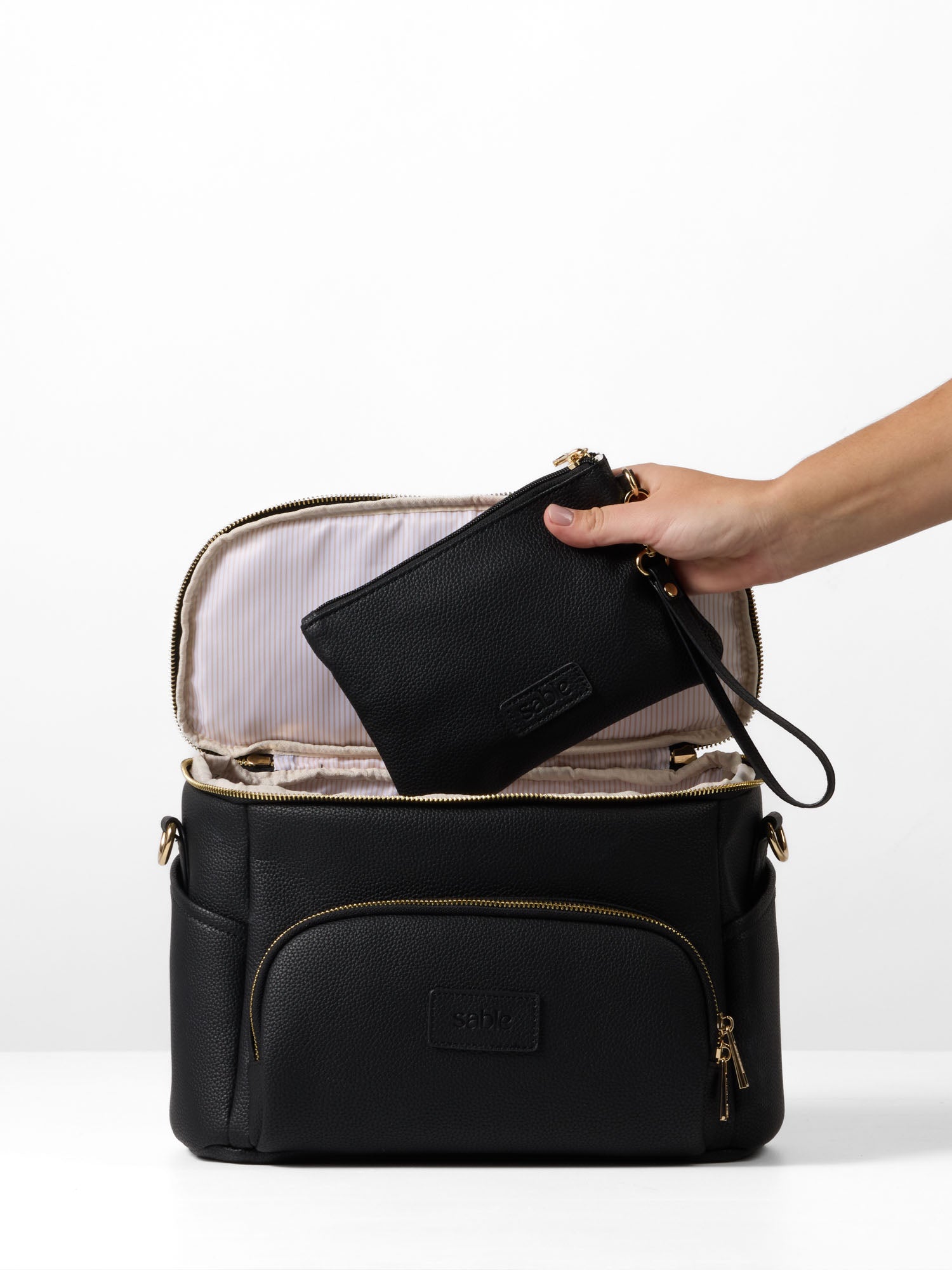 Black pram caddy organiser with matching essentials pouch and stroller attachment straps