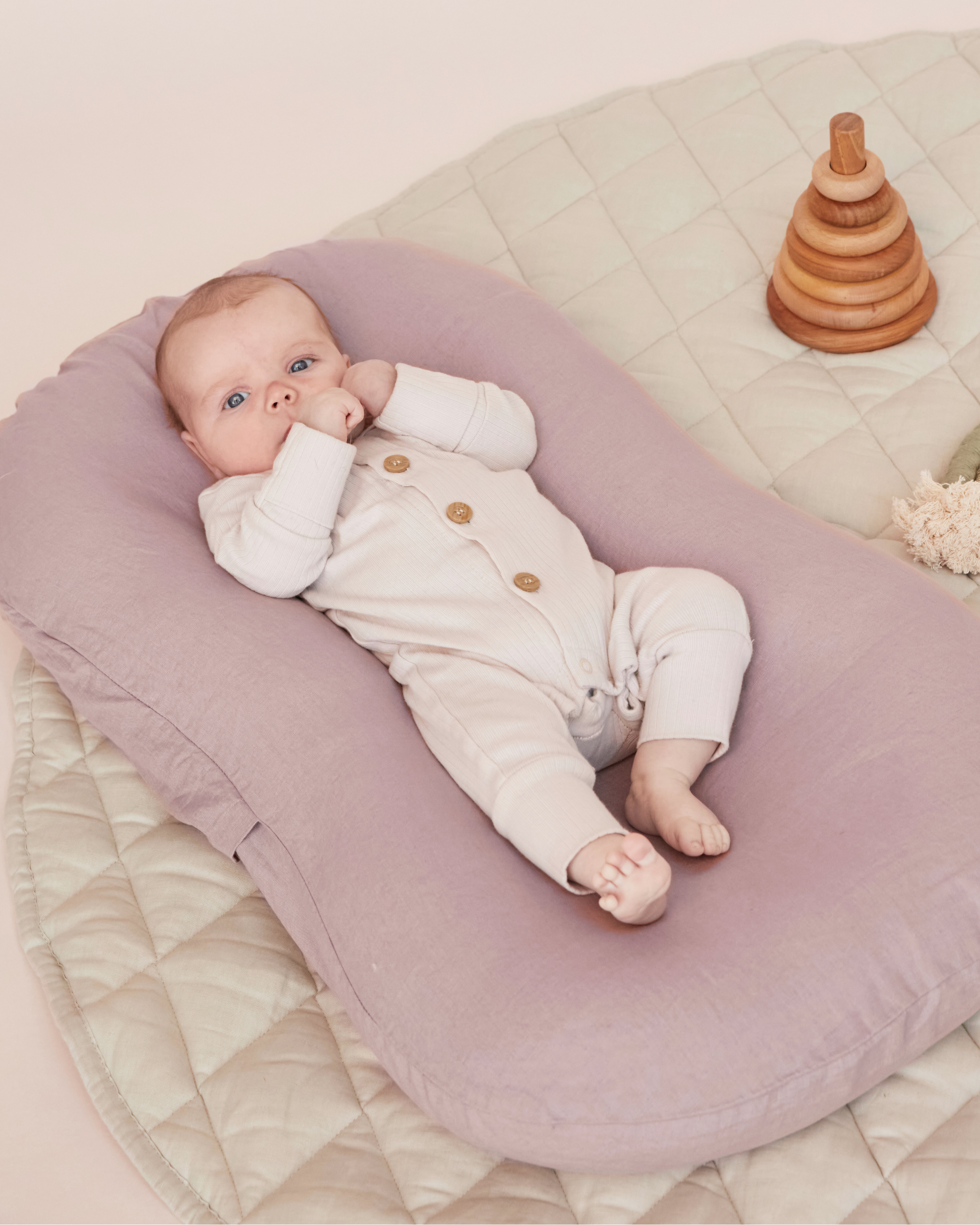Linen baby nest for cosy, secure lounging