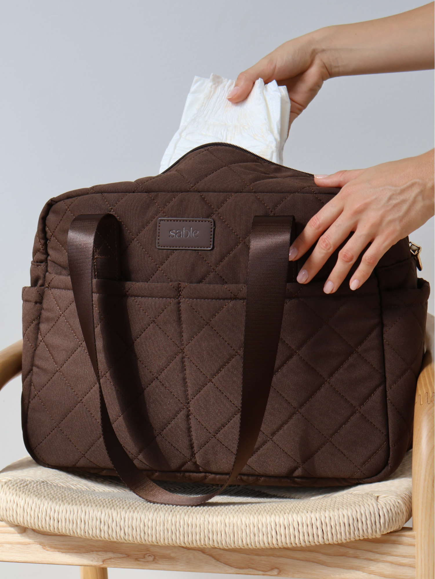 Chocolate Quilted Nappy Bag quilted nappy bag with spacious storage for baby travel and everyday parenting neutral nursery styling