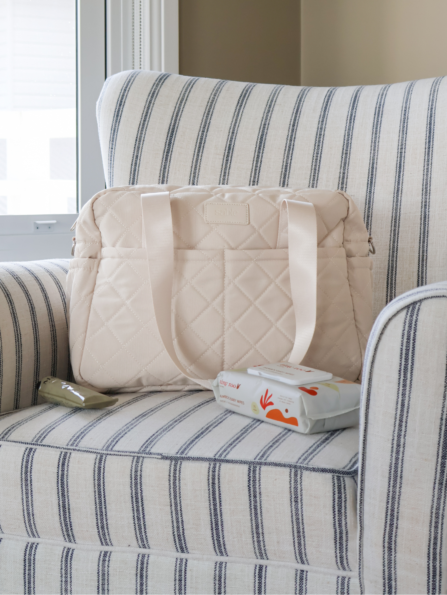 Sand Quilted Nappy Bag quilted nappy bag with spacious storage for baby travel and everyday parenting neutral nursery styling