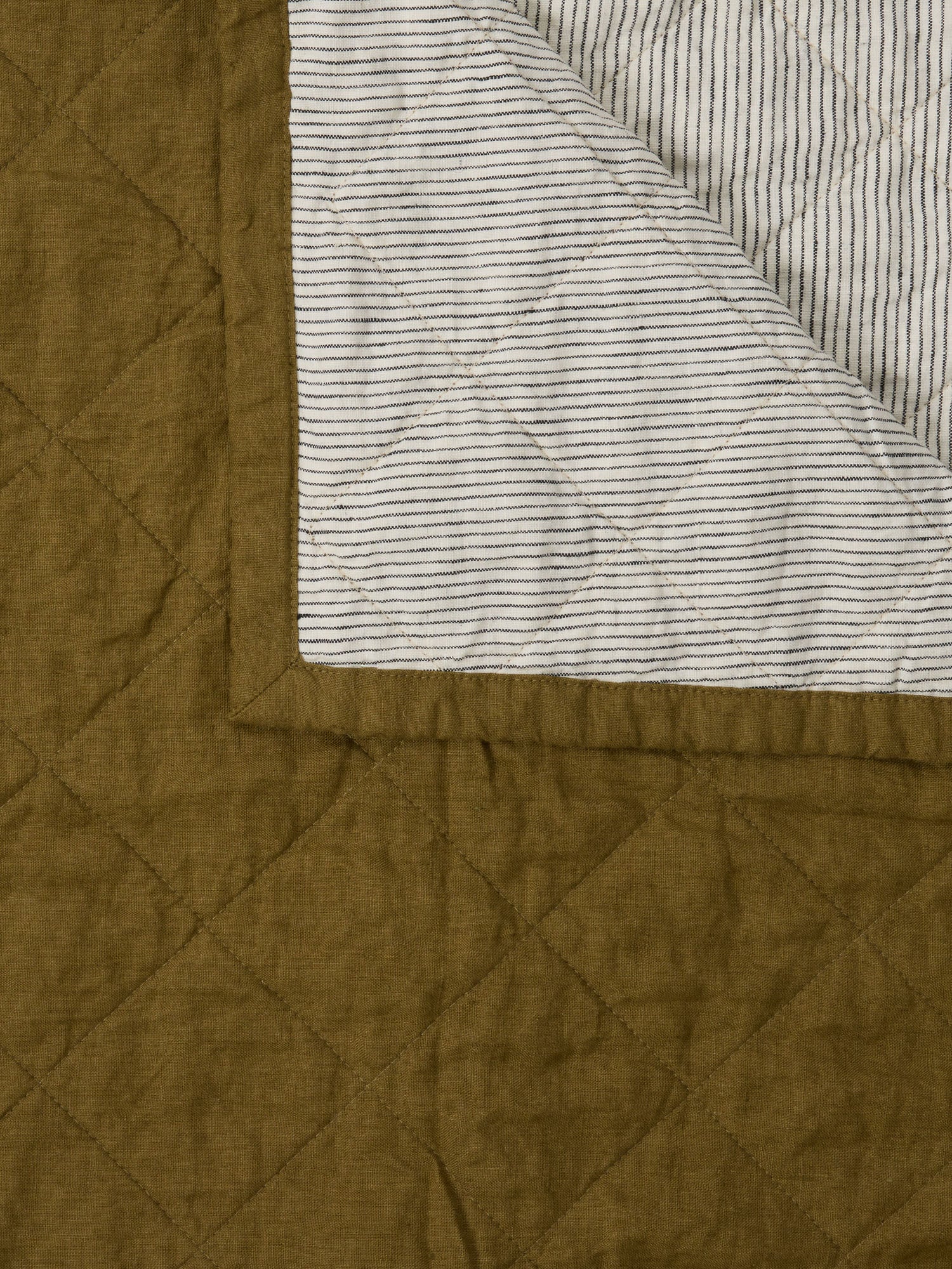 Olive and Pinstriped Cot Quilt luxury linen cot quilt for modern nursery decor and baby room styling luxury nursery essential