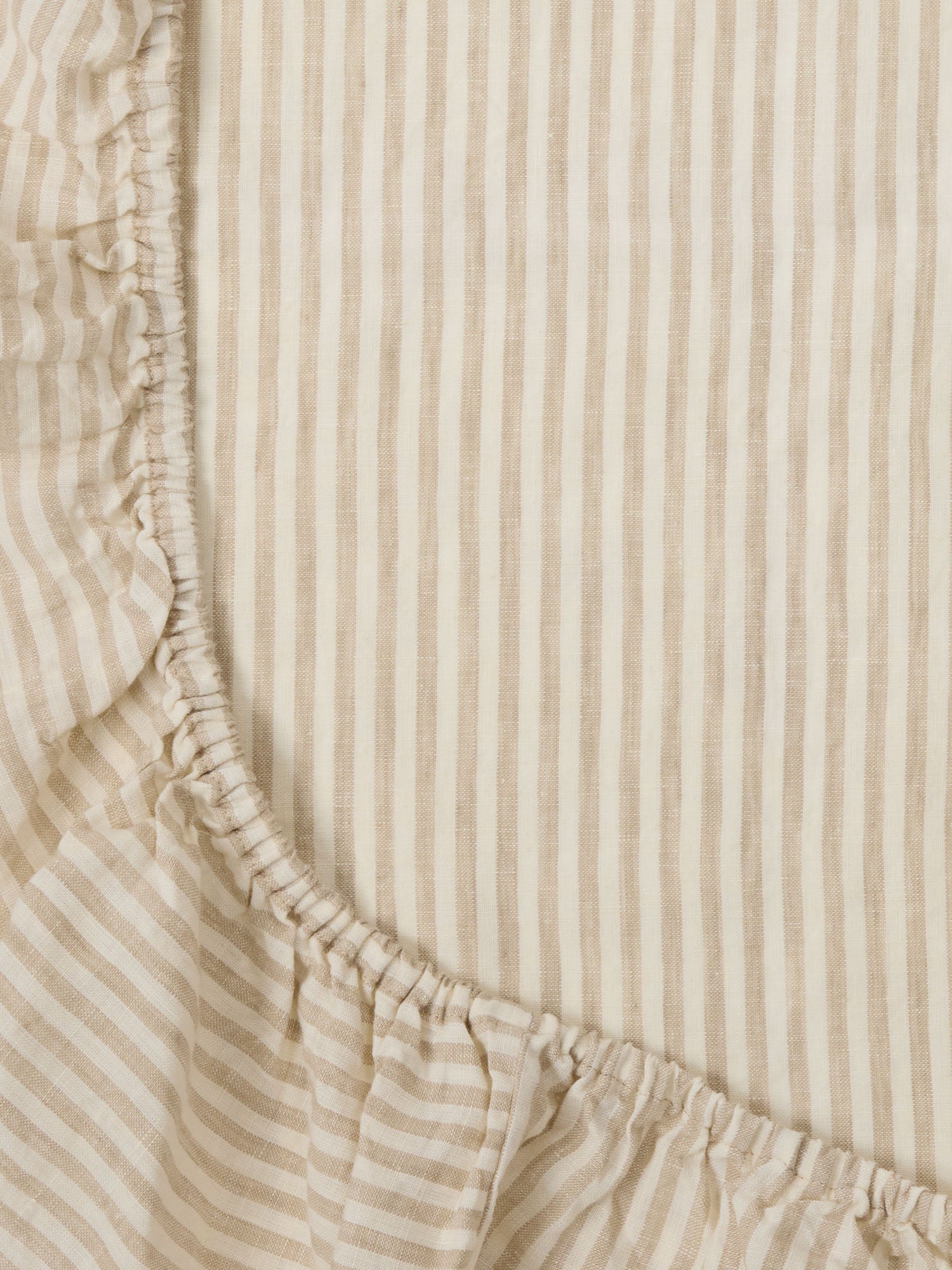 Natural Striped Linen Sheet made from breathable 100% pure linen baby bedding for modern nursery styling luxury nursery essential