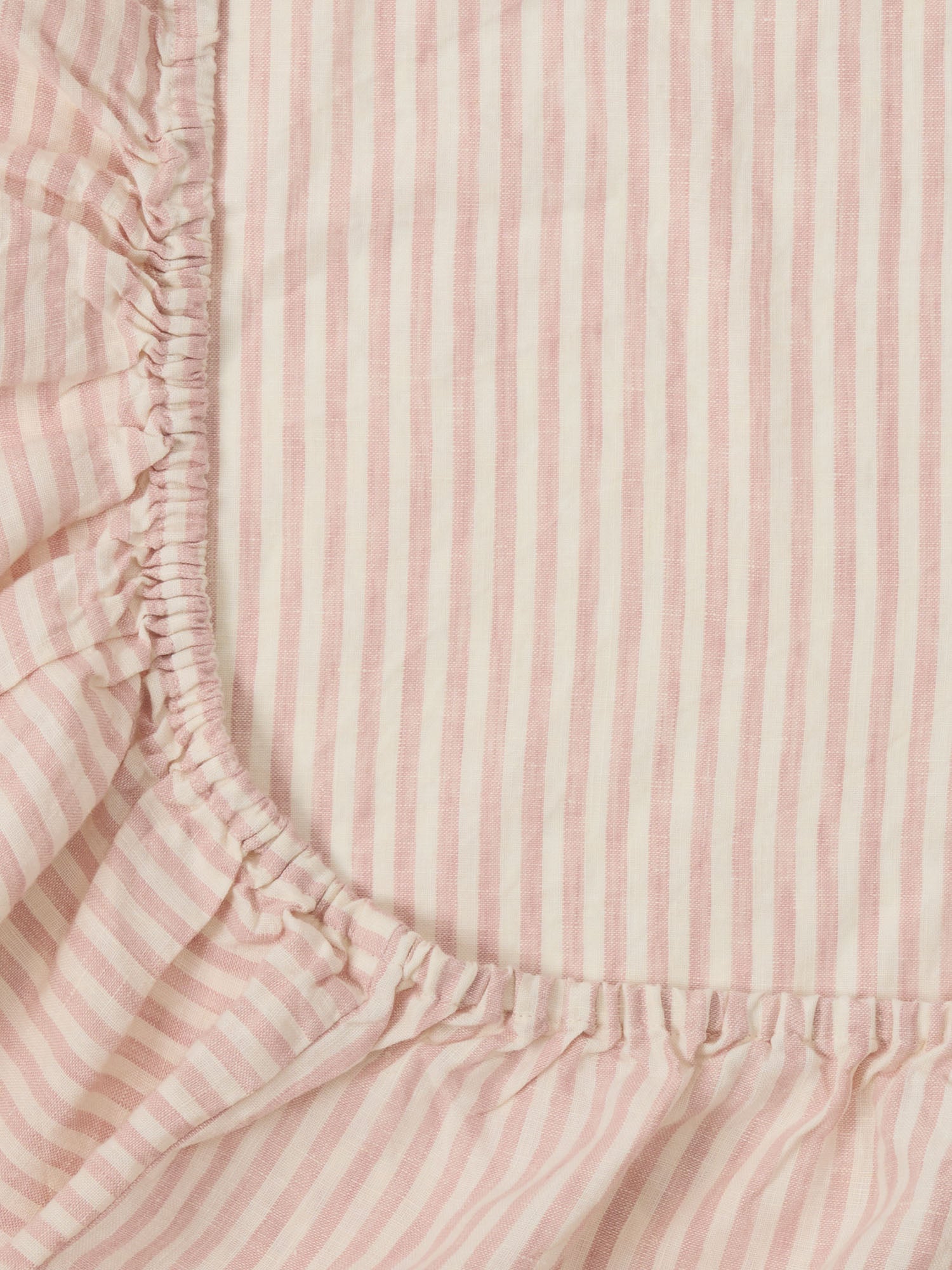 Pink Striped Linen Sheet made from breathable 100% pure linen baby bedding for modern nursery styling luxury nursery essential