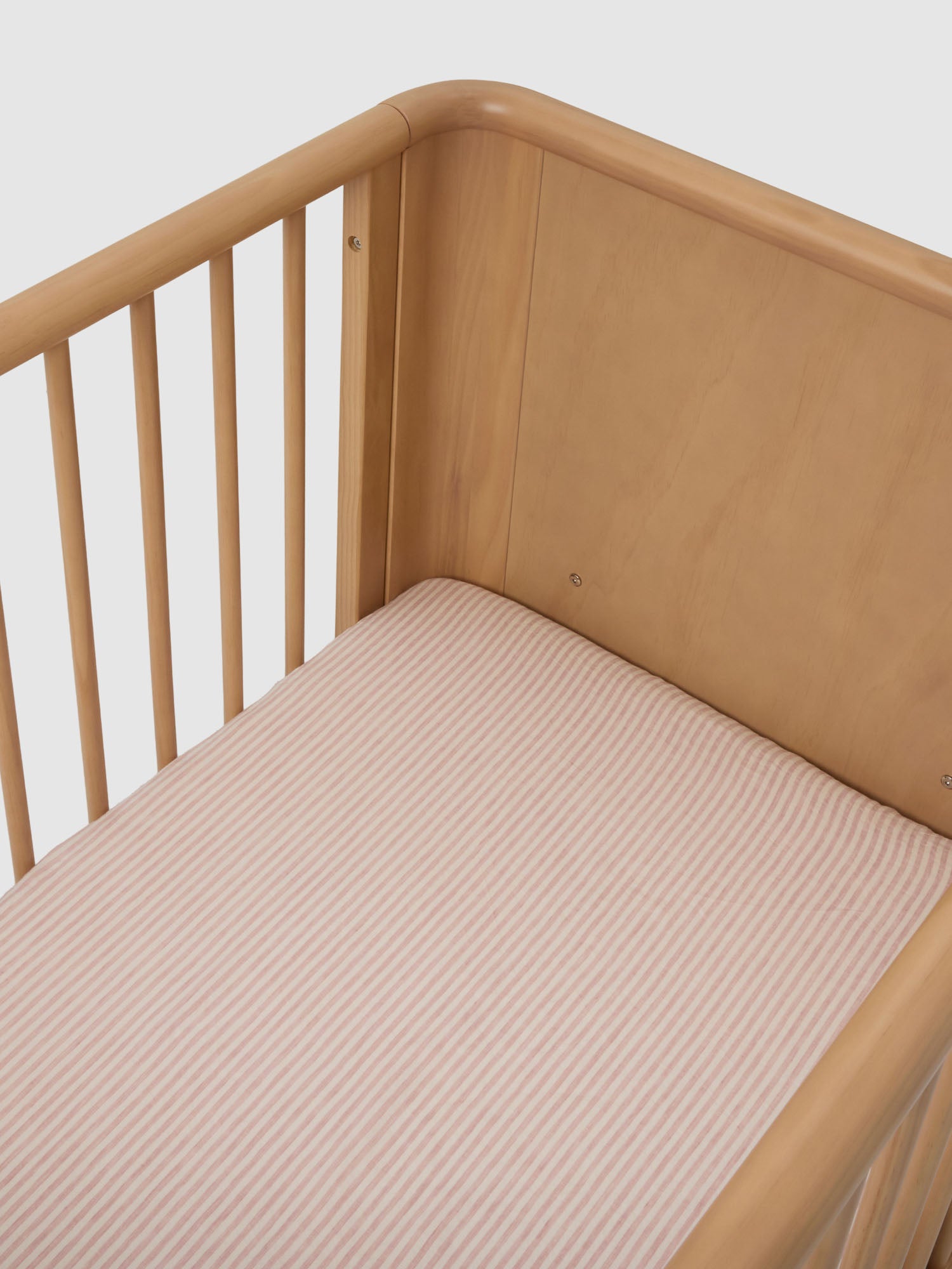 Pink Striped Linen Cot Sheet made from breathable 100% pure linen baby bedding for modern nursery styling luxury nursery essential