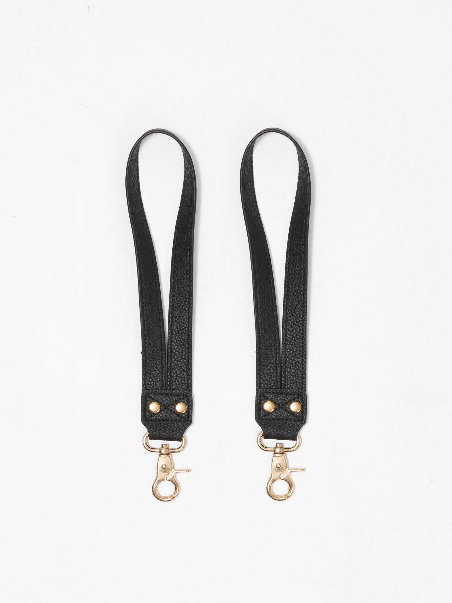 Vegan leather stroller straps designed to keep baby bags secure and within easy reach