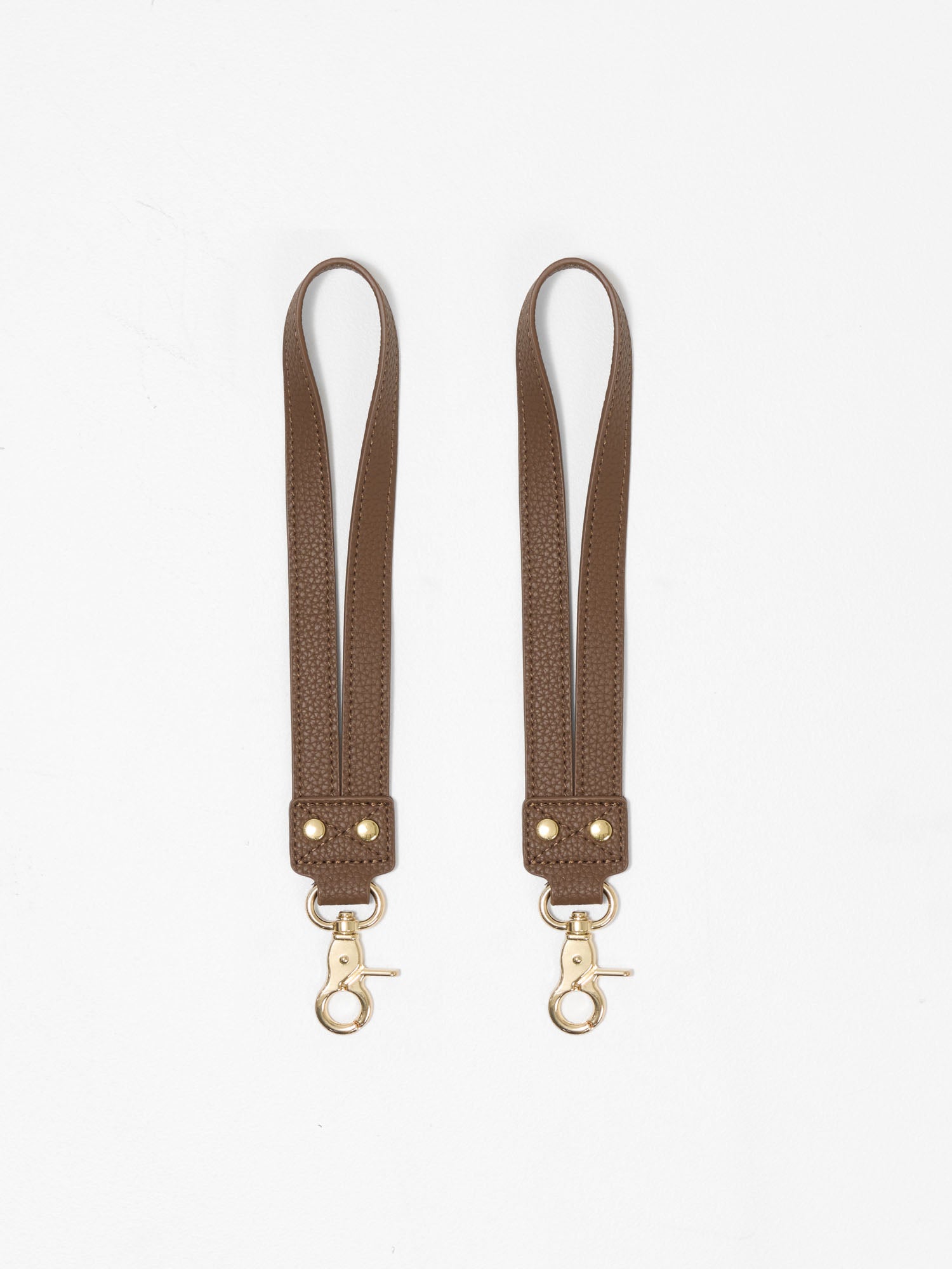 Universal pram straps with secure attachments for nappy bags, backpacks and pram caddies