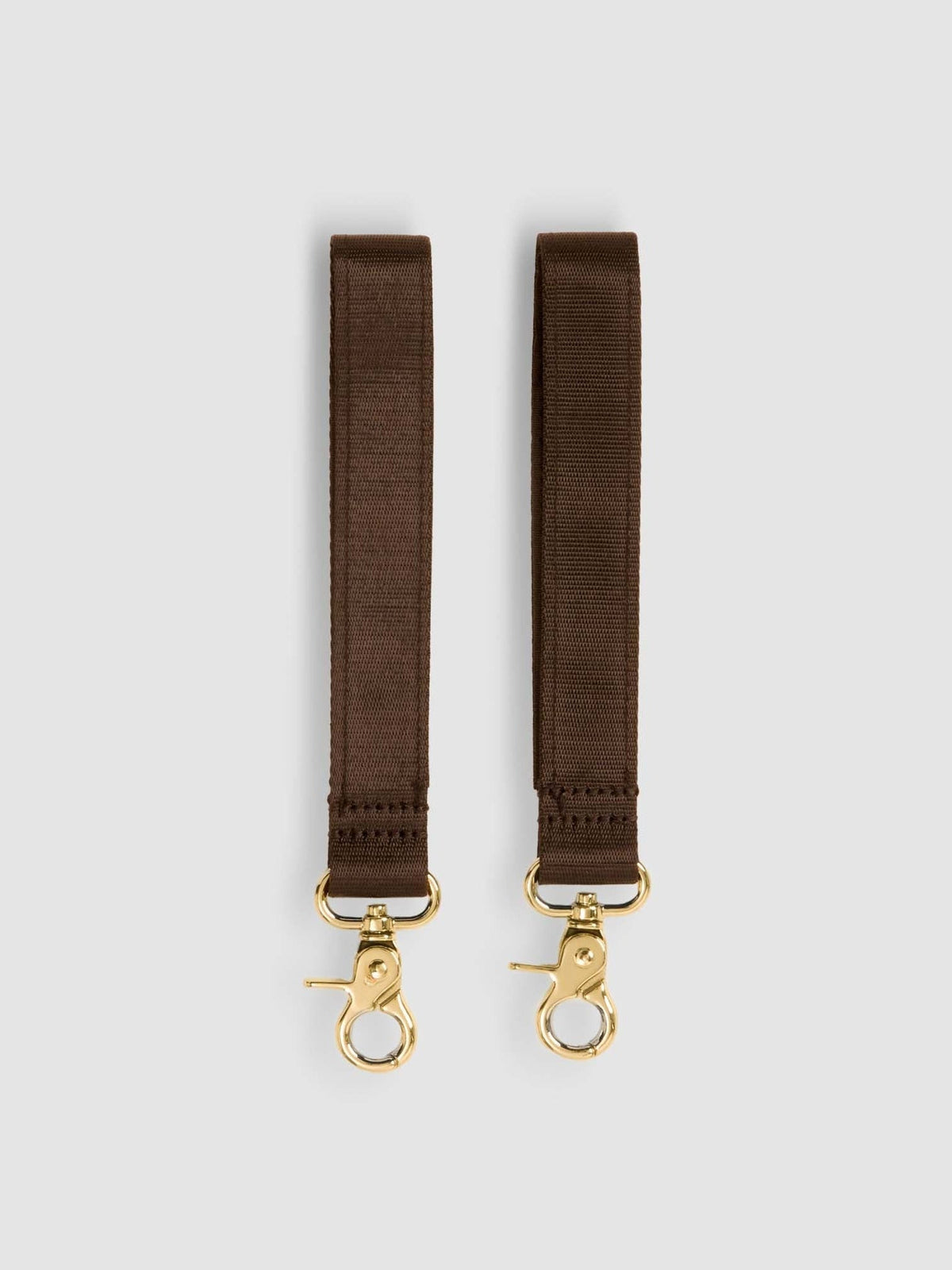 Pair of chocolate Velcro pram straps with gold swivel clips