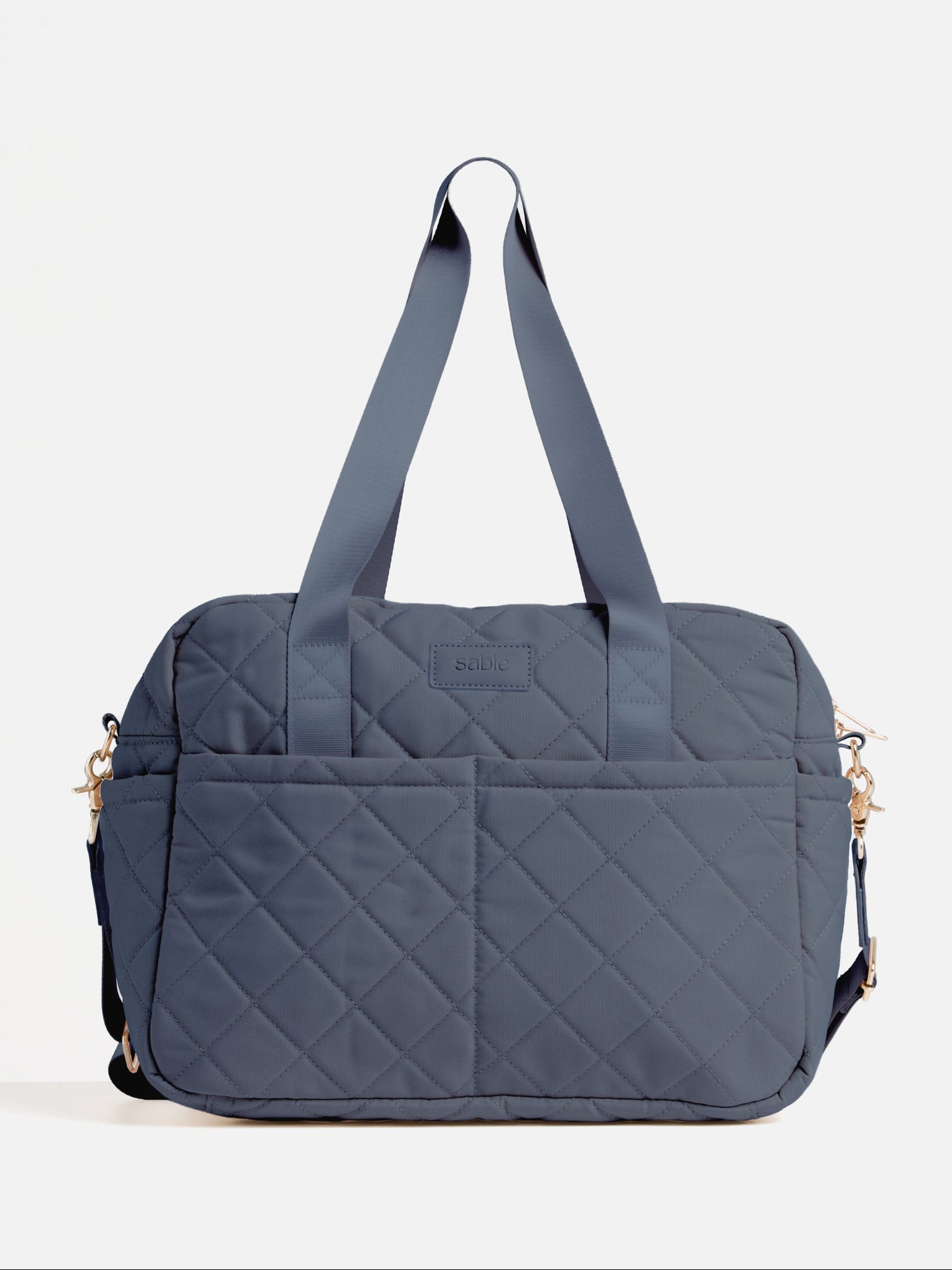Dusty Blue Quilted Nappy Bag front product view with spacious storage compartments