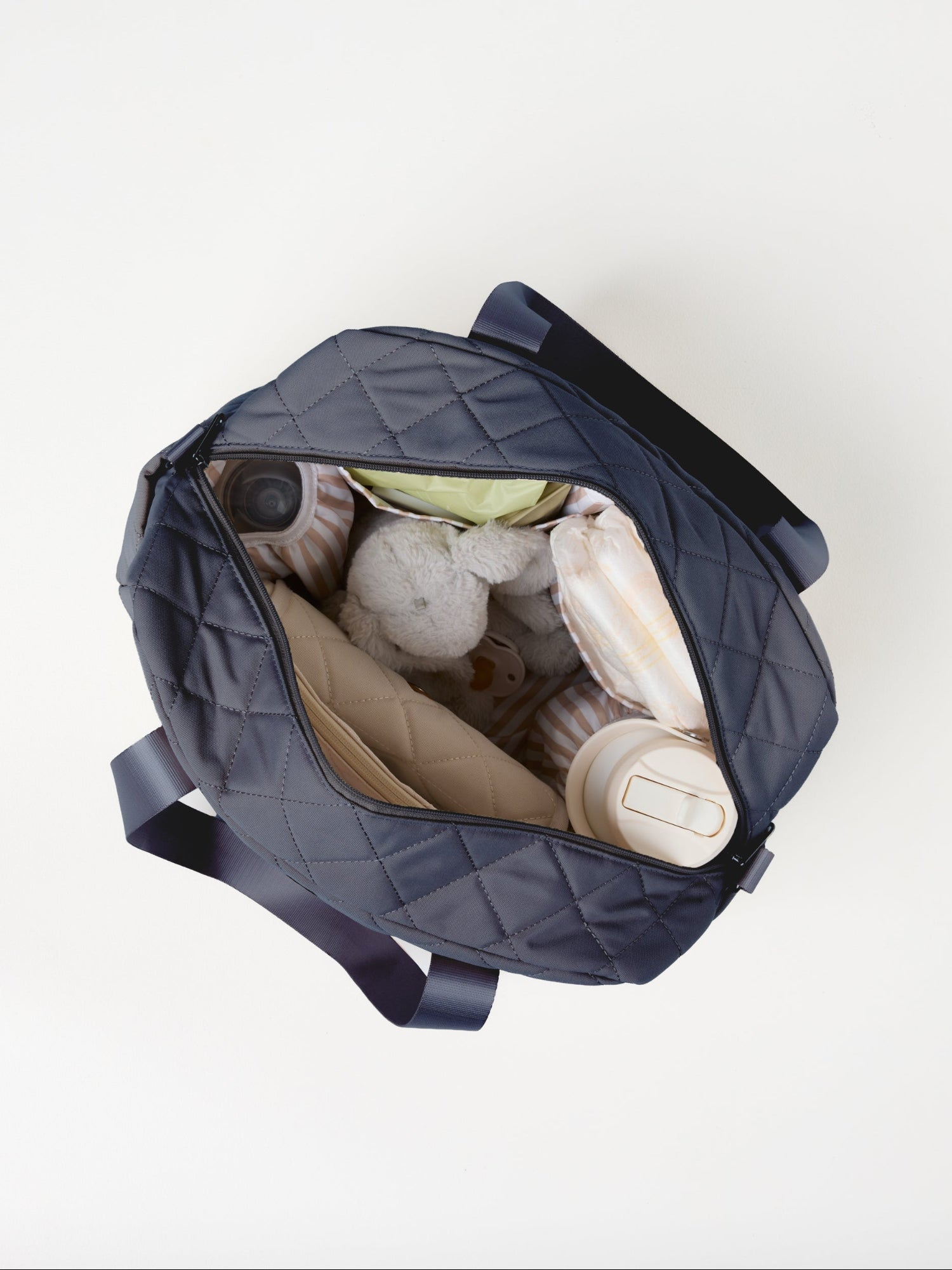Dusty Blue Quilted Nappy Bag flat lay product image with spacious storage compartments