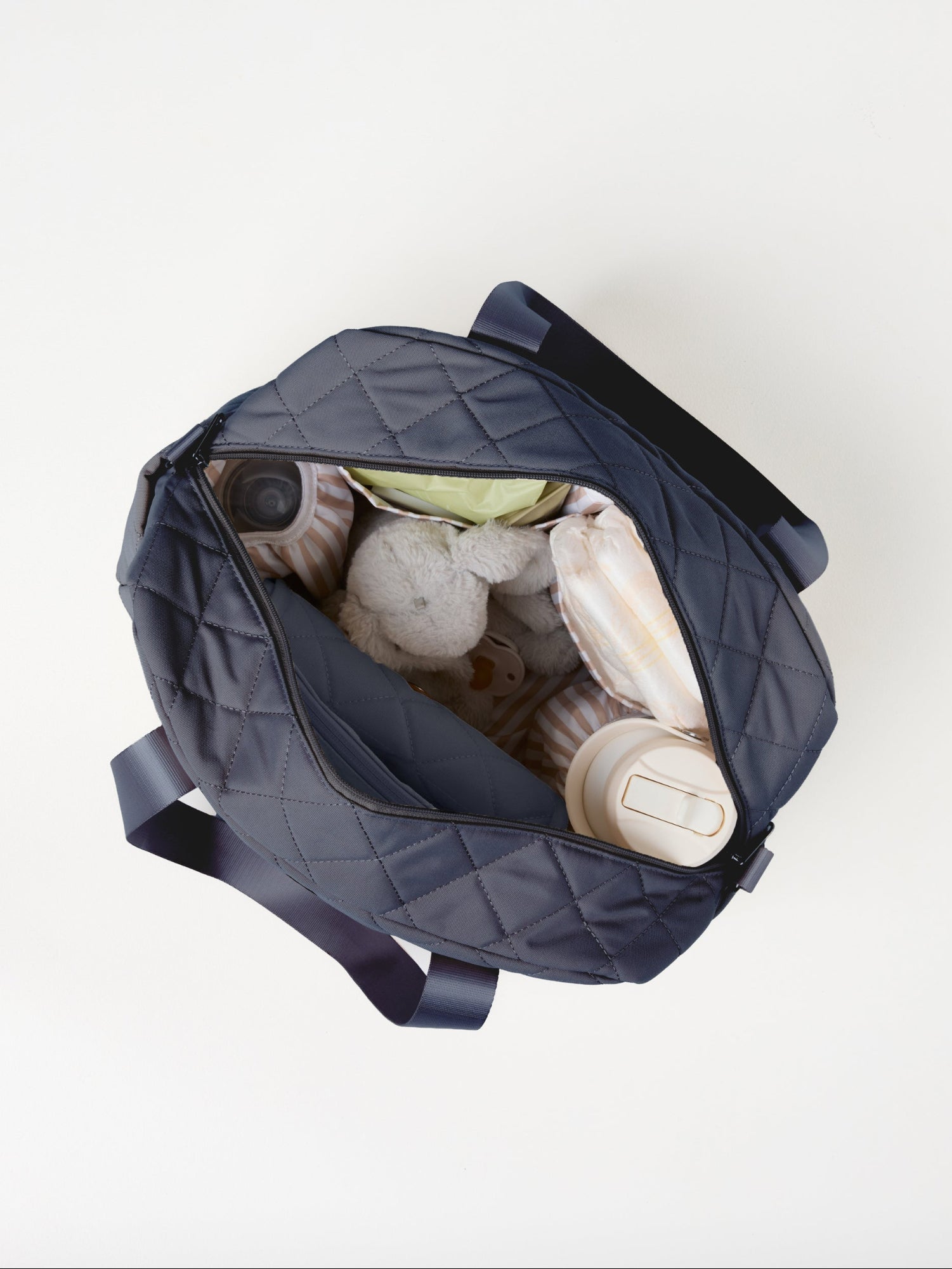 Dusty Blue Quilted Nappy Bag flat lay product image with spacious storage compartments