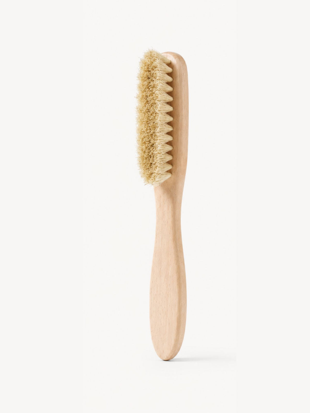 Wooden brush with natural bristles used to care for your suede bags - Sable Bebe