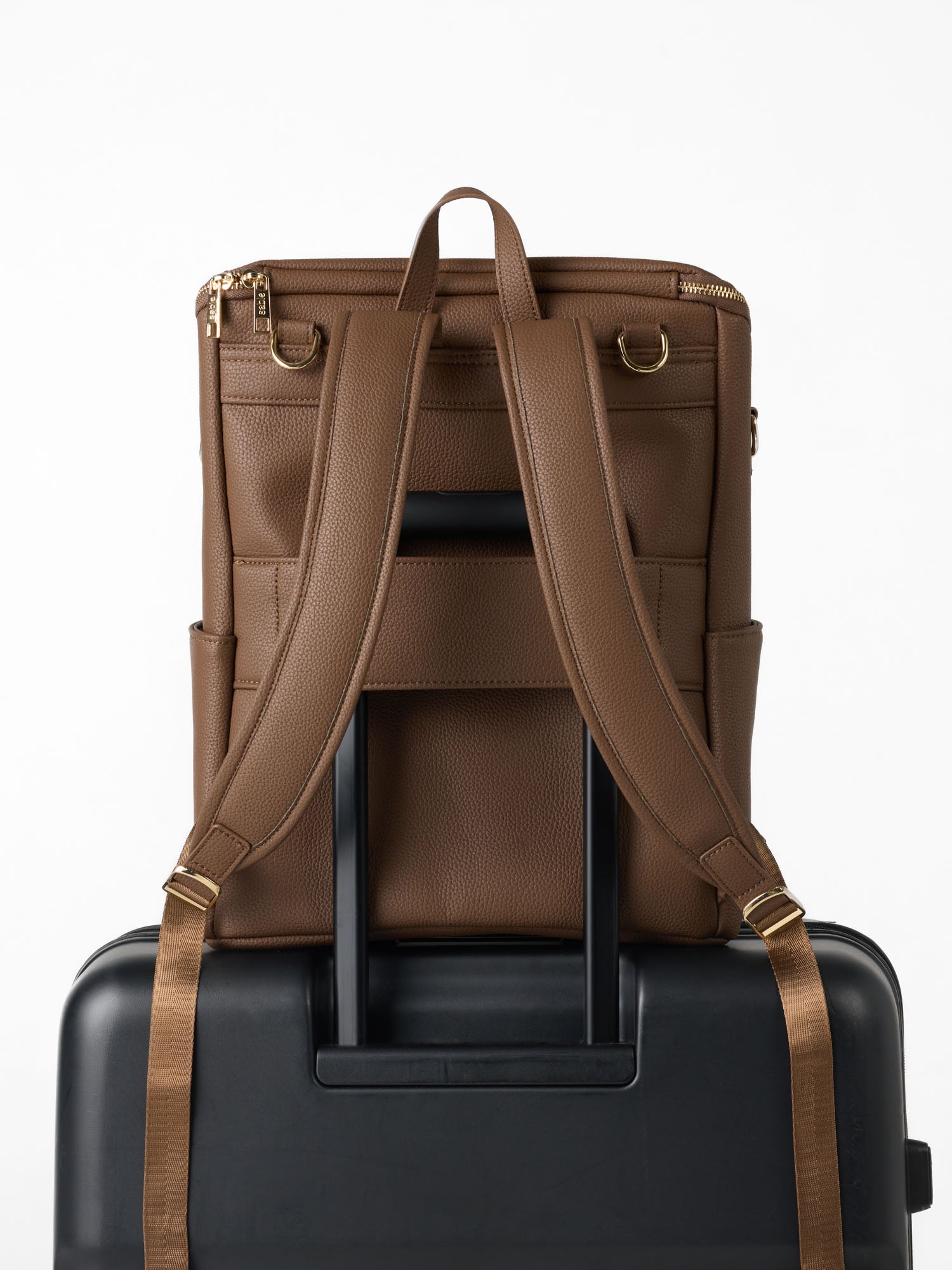 Parent nappy backpack featuring a rear luggage sleeve for convenient airport and travel use