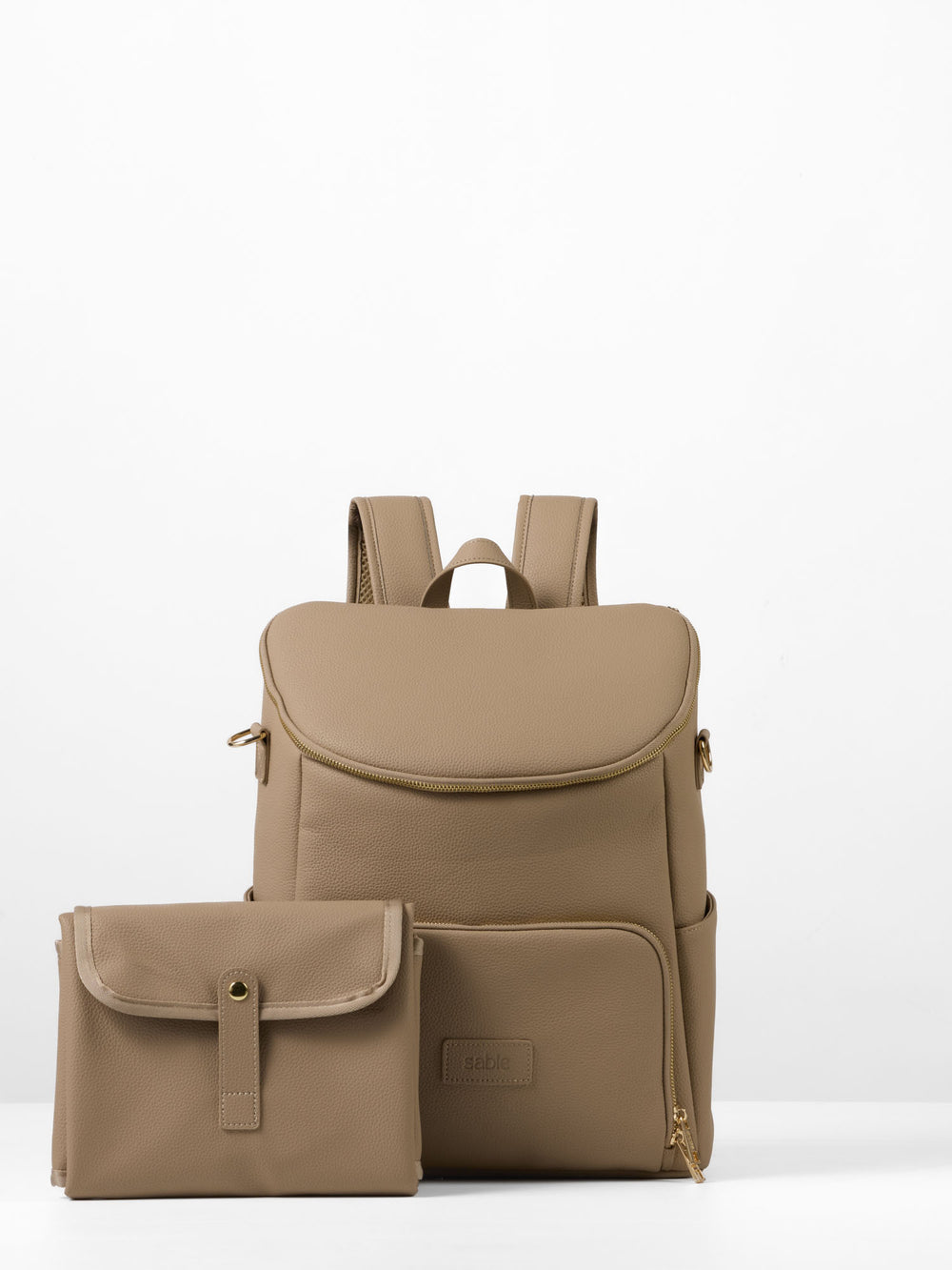 Taupe vegan leather nappy backpack with matching folded change mat