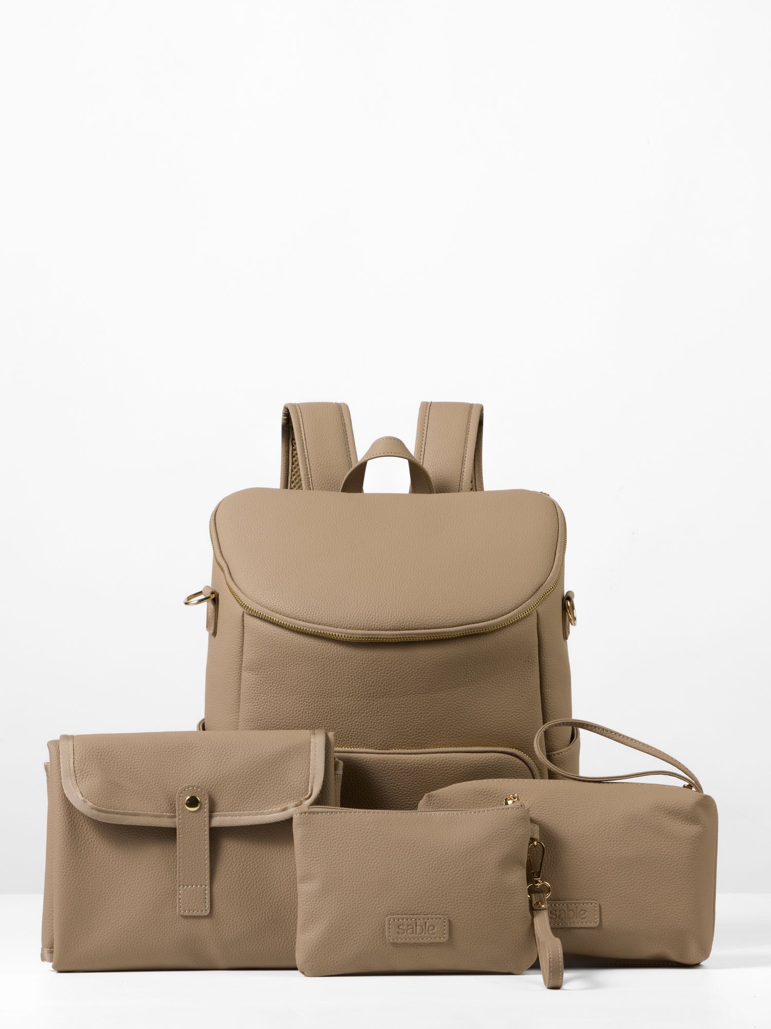 Vegan leather nappy backpack in taupe with multiple storage compartments for baby essentials