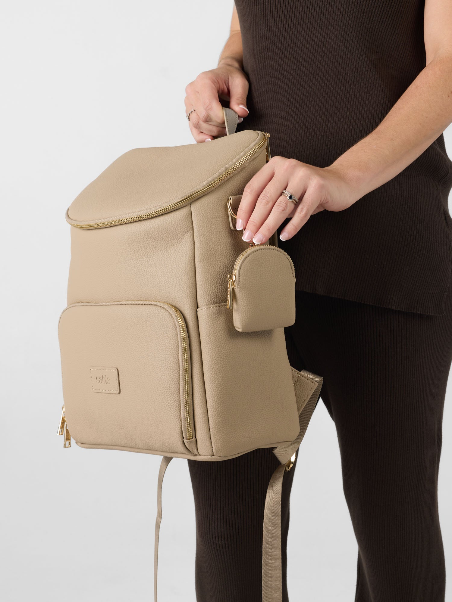 Matching vegan leather nappy bag set and dummy pouch set
