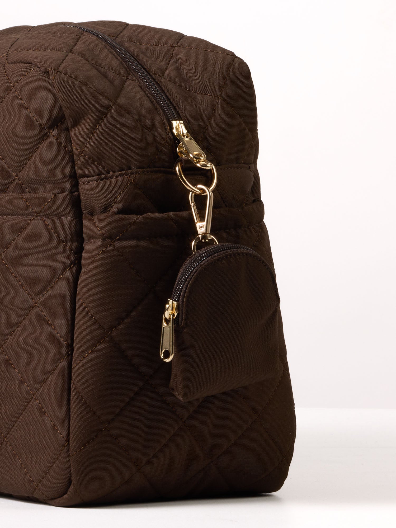 Matching dummy pouch from the quilted nappy bag accessories collection