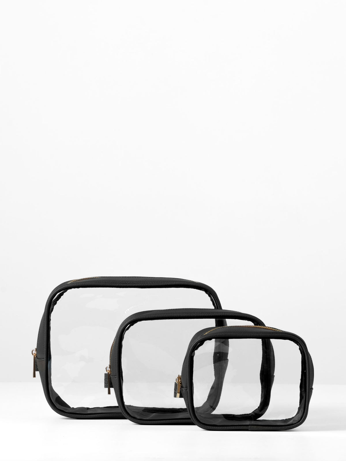 Set of three clear organiser cases with black vegan leather trim