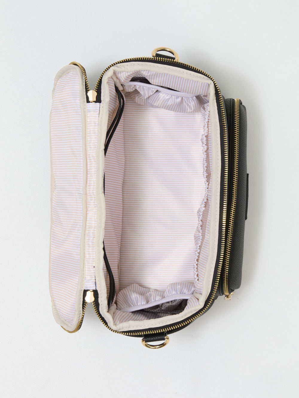 Top view of the open black pram caddy showing its lining and bottle pockets