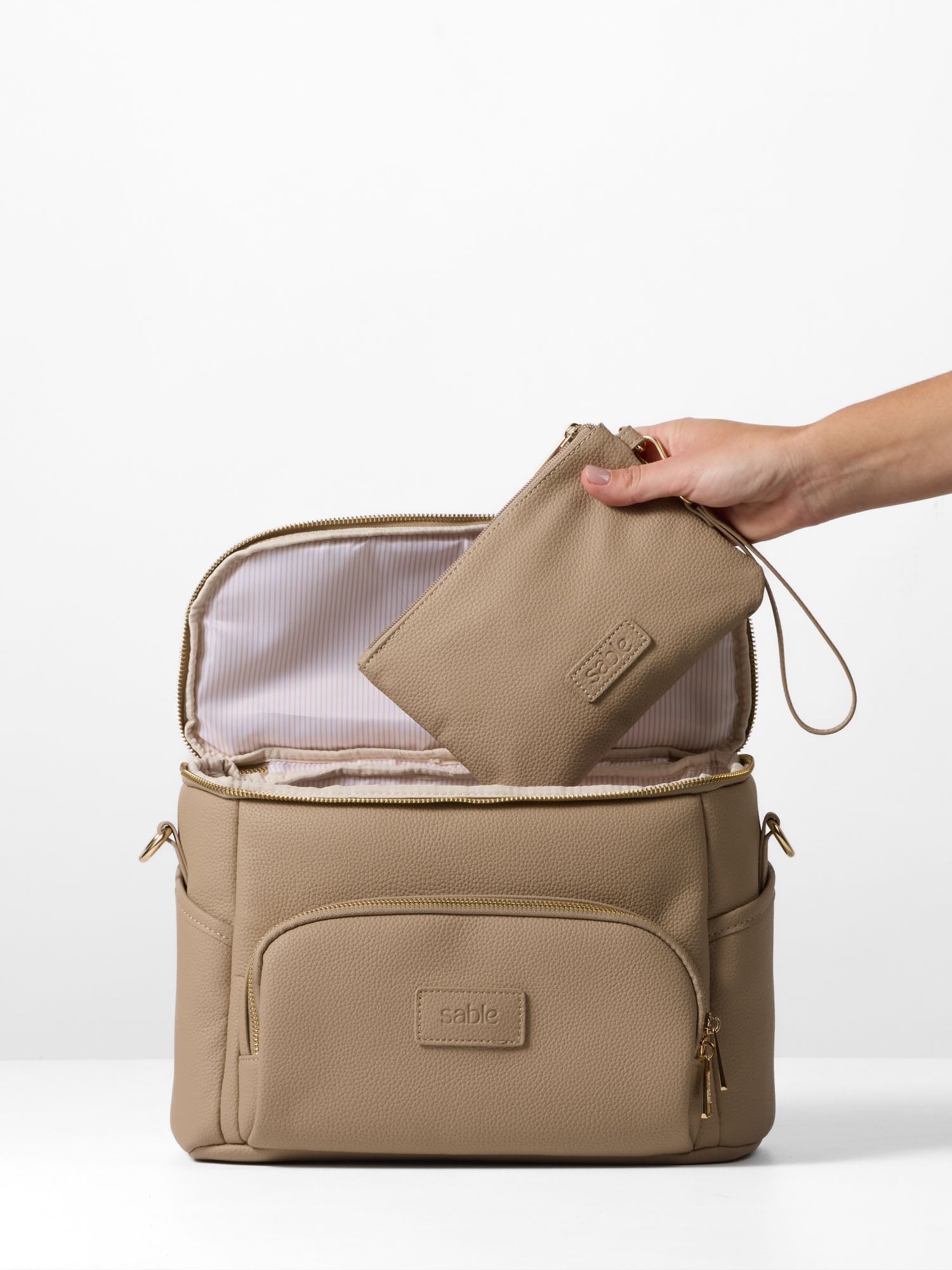 Vegan leather pram caddy and pouch set in taupe for baby essentials and daily outings