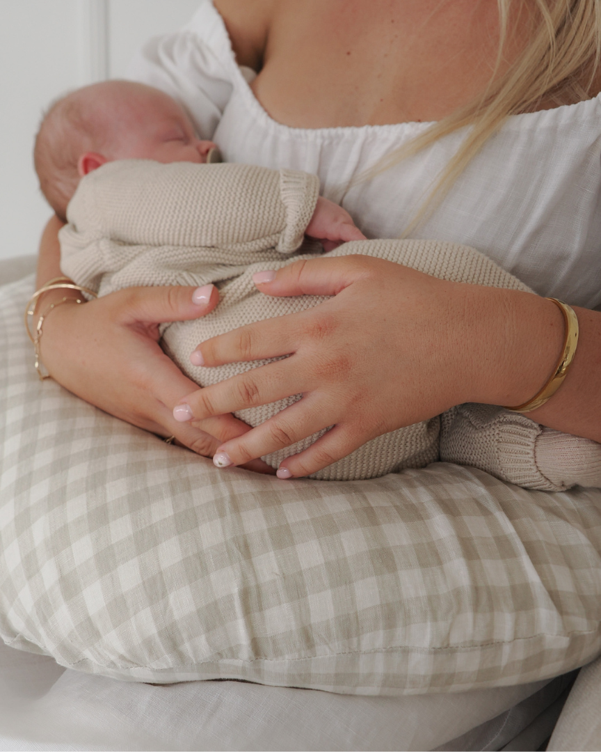 Supportive nursing pillow in soft grey gingham