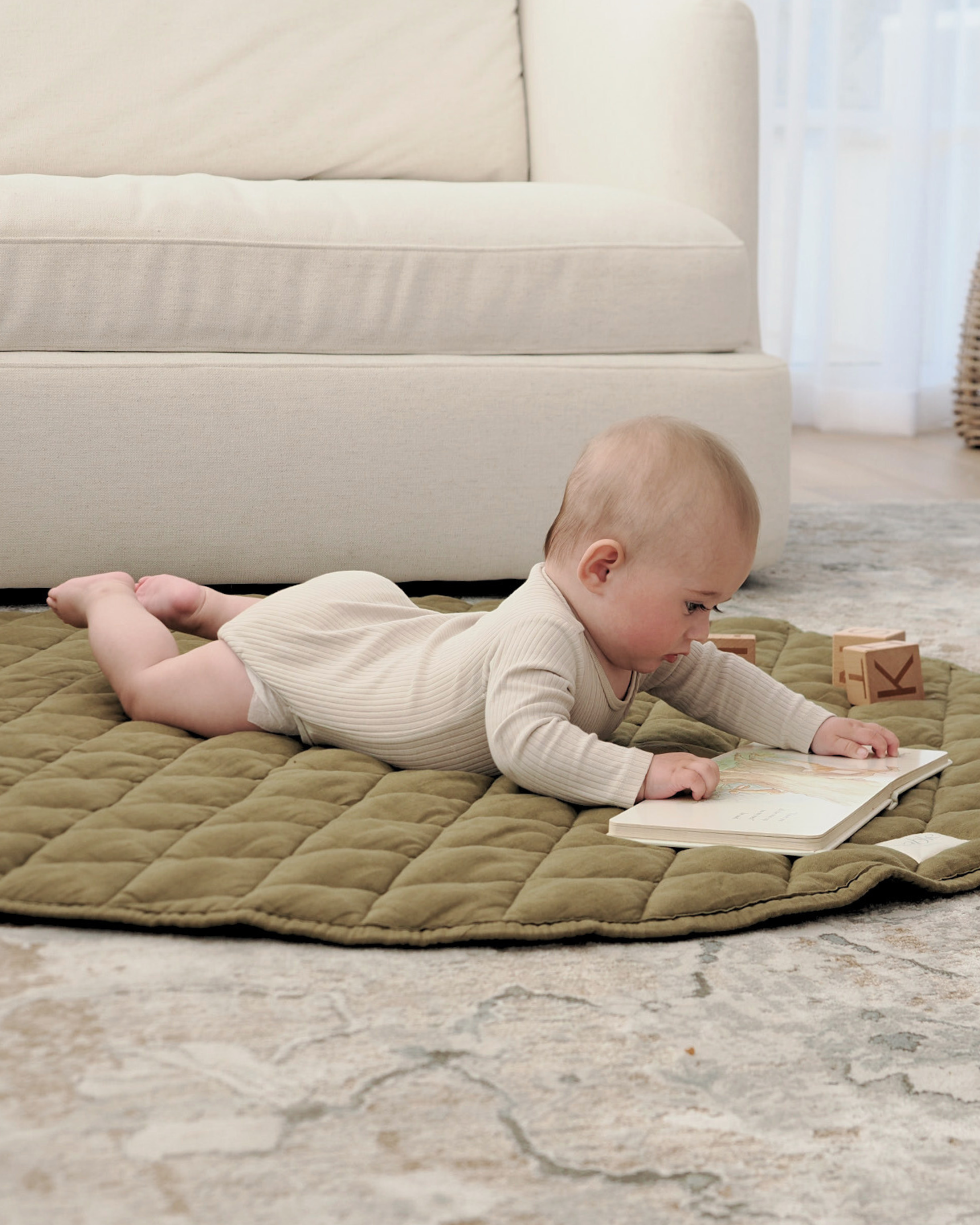 Textured linen playmat for newborn development