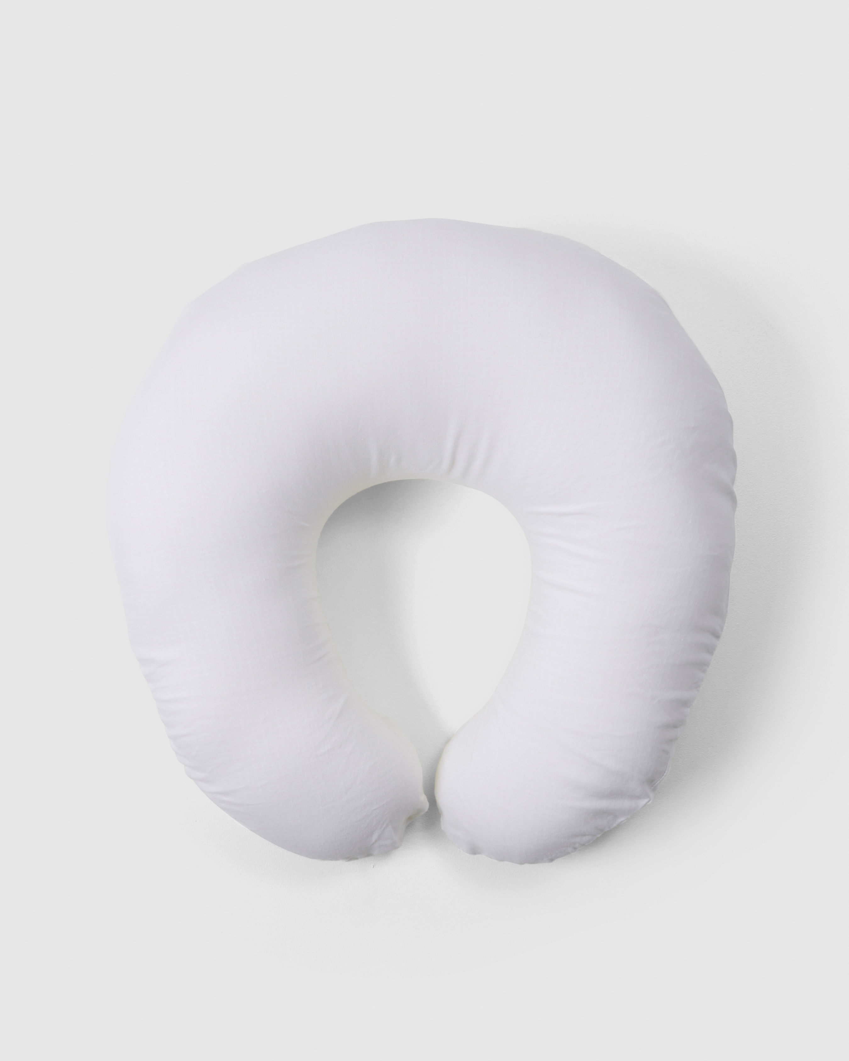 Breastfeeding pillow in white linen