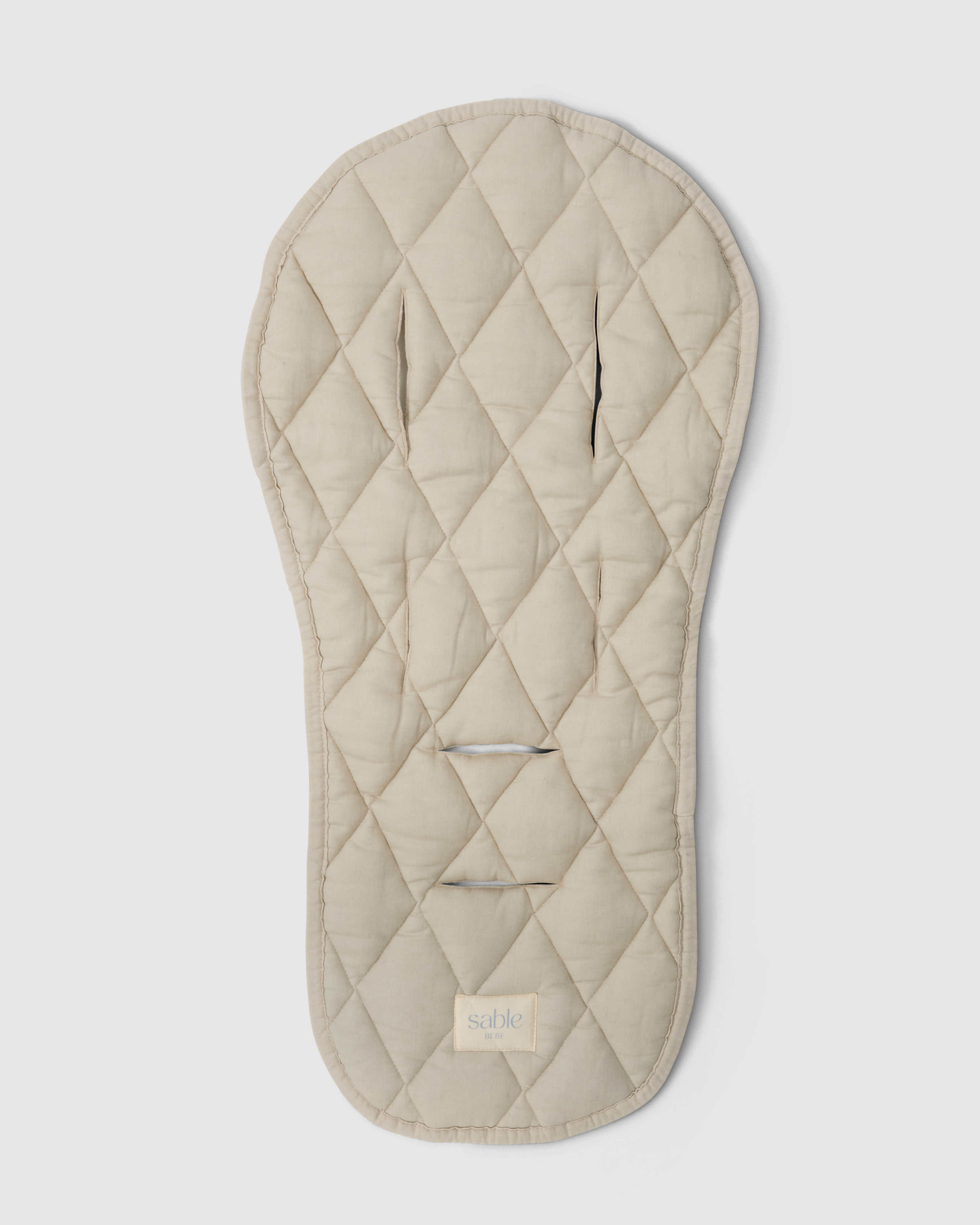 Quilted pram liner with reversible design
