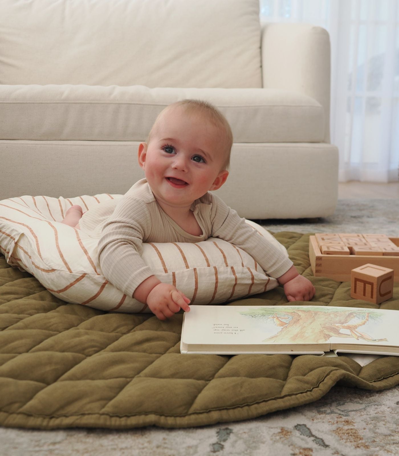 Baby lounger being used to assist with supervised tummy time - sable bebe