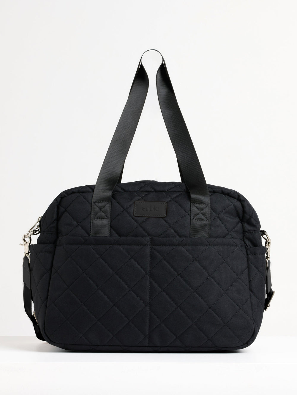 Black quilted nappy bag with shoulder strap, front view