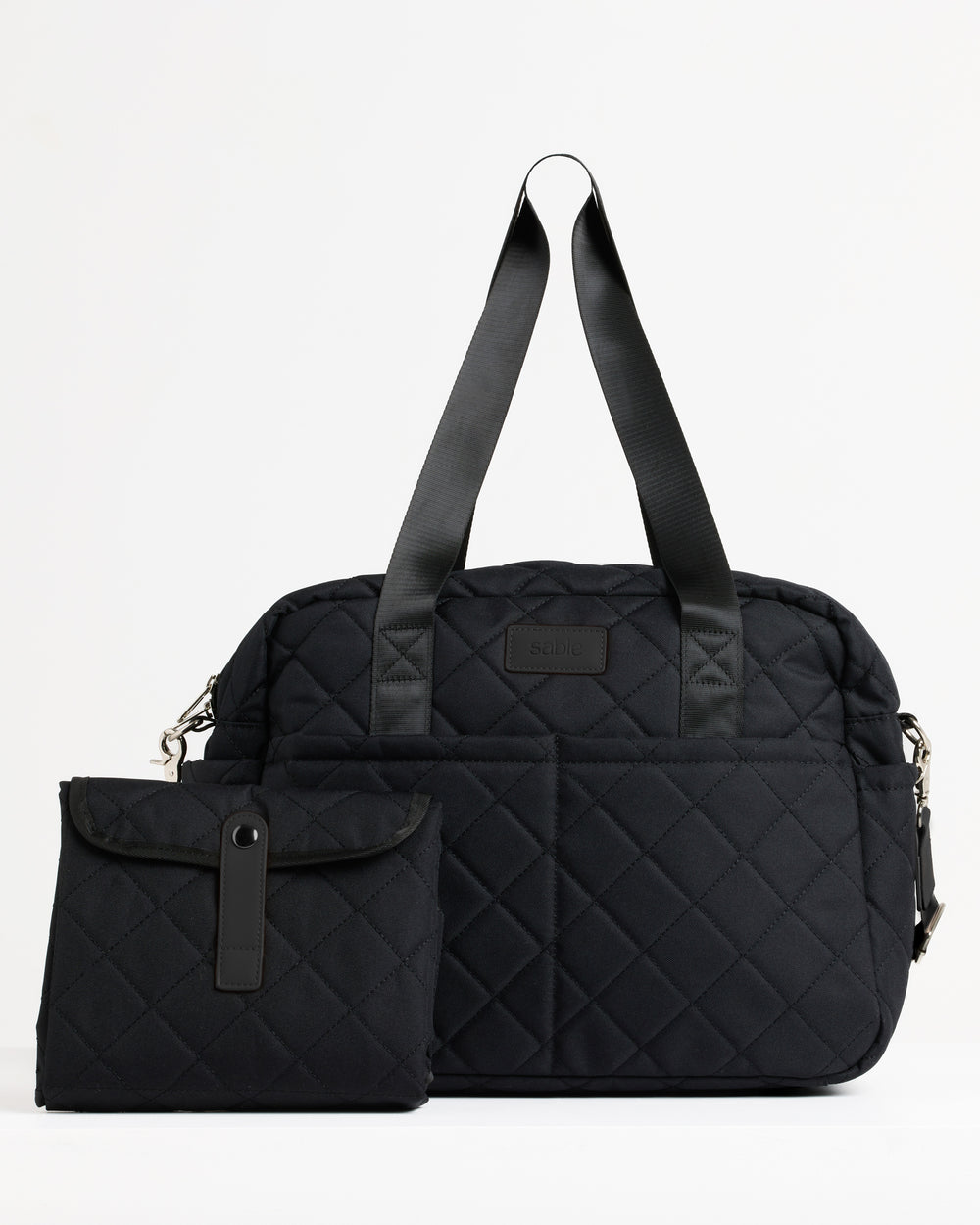 Black quilted nappy bag with matching folded change mat