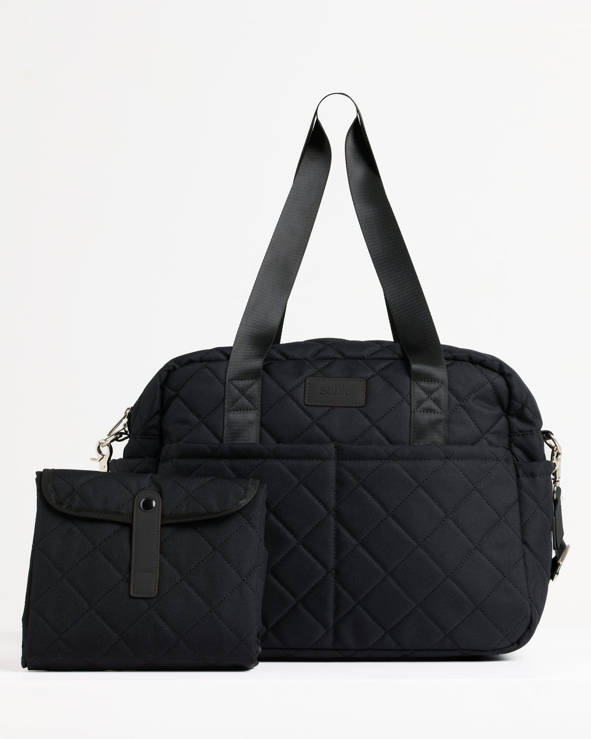 Black quilted nappy bag with matching folded change mat